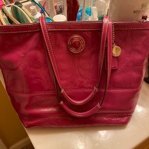 Pink Coach Purse…minor wear on the handles (see pictures).  Good condition